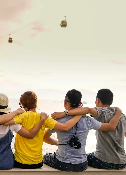 Group of young friends at a viewpoint on holiday