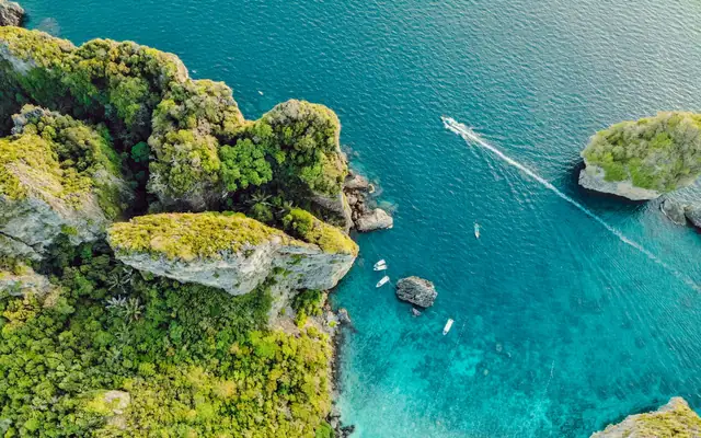 Aerial view of a tropical Thai island and turquoise sea