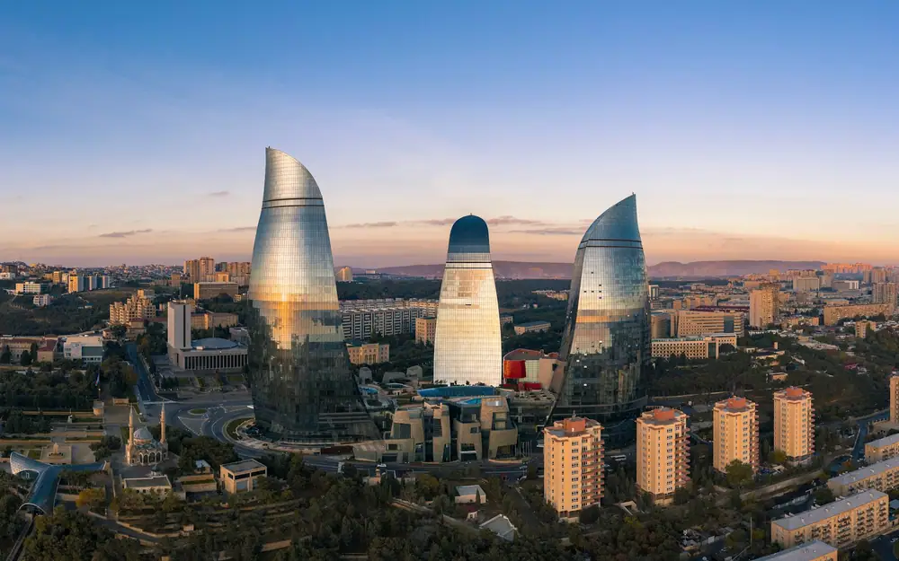 Baku skyline and Flame Towers under a blue sky
