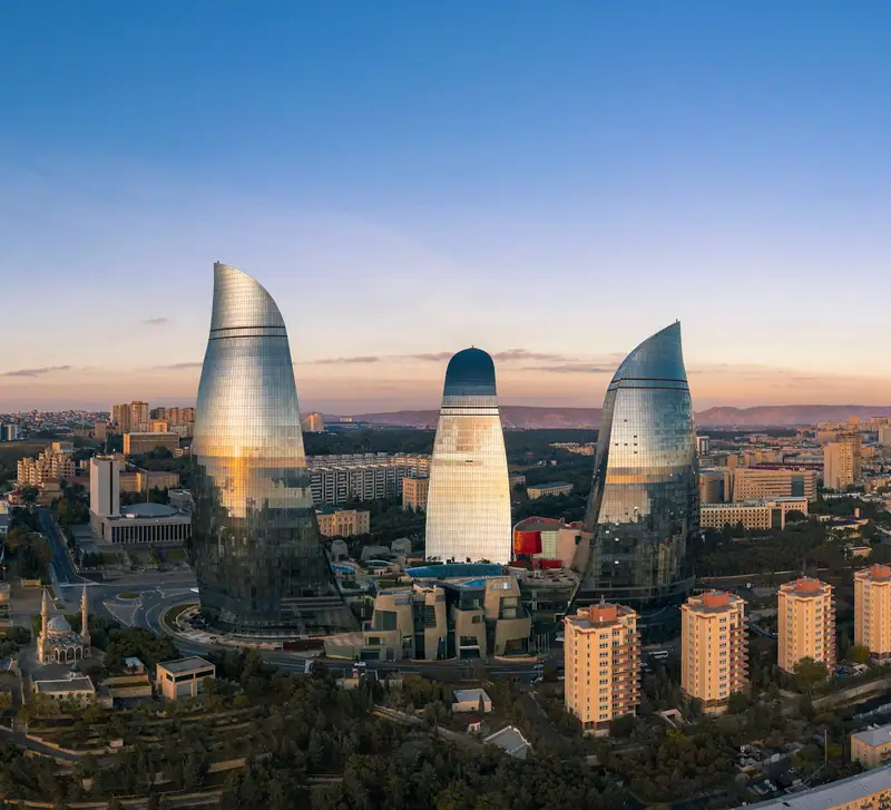 Baku skyline and Flame Towers under a blue sky