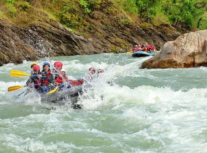 Group rafting down a river
