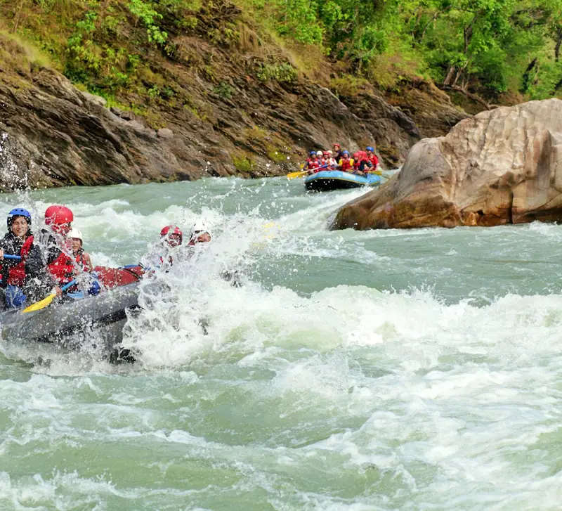 Group rafting down a river