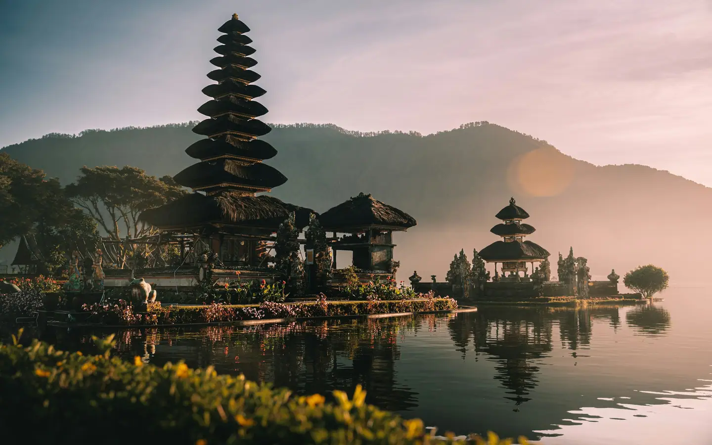 Pura Ulun Danu Bratan temple on a lake in Bali at golden hour