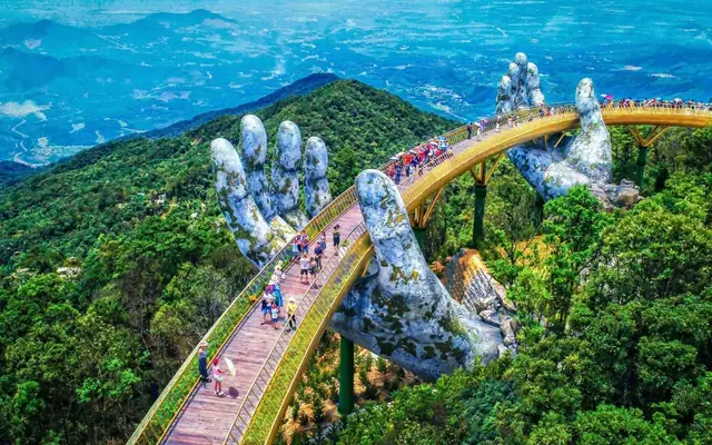 Golden Bridge held by giant stone hands at Ba Na Hills, Vietnam